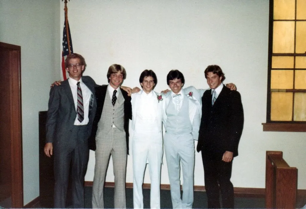 A family photo of groomsmen at a wedding