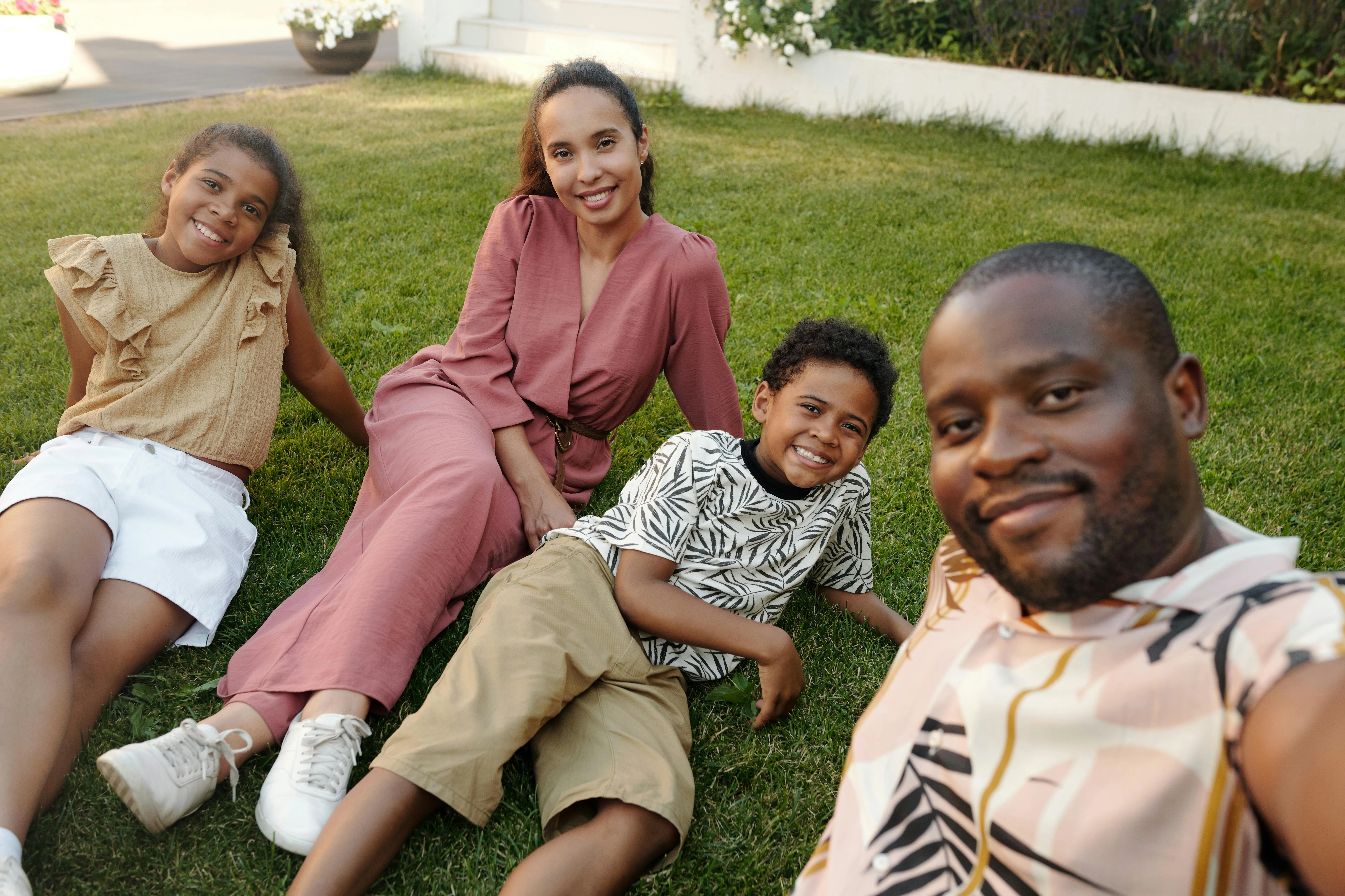 A family photo of a family on the lawn
