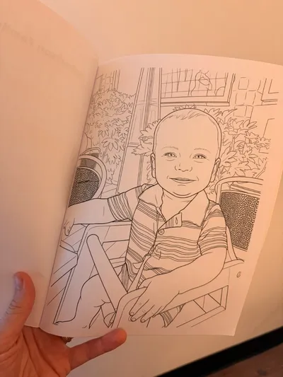Coloring page of a smiling toddler in a striped polo shirt