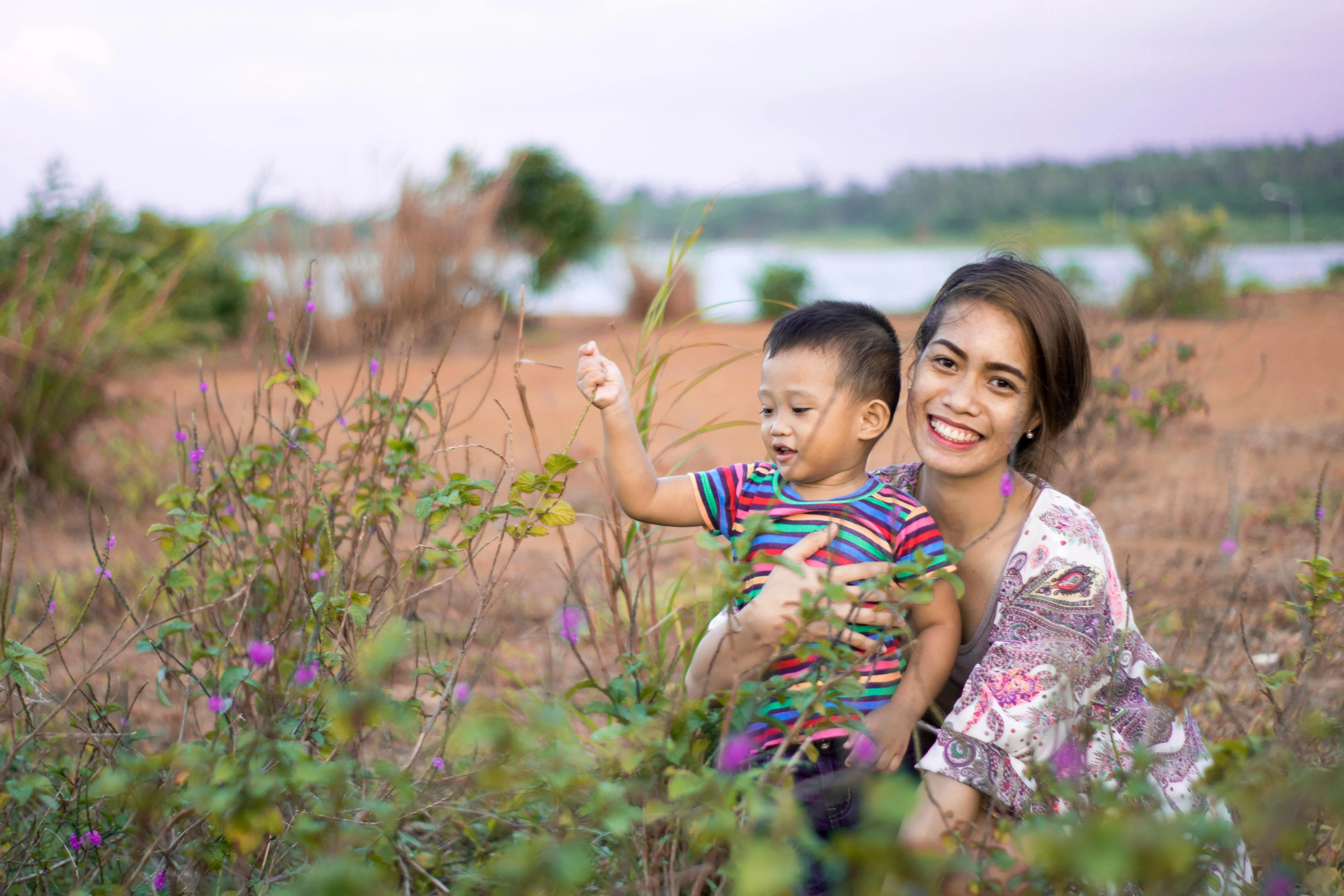 A family photo of a woman hugging a boy